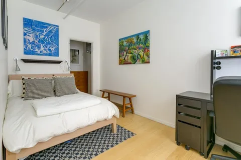 a bedroom with a bed and furniture