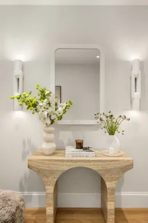 a building outdoor space with patio furniture and potted plants