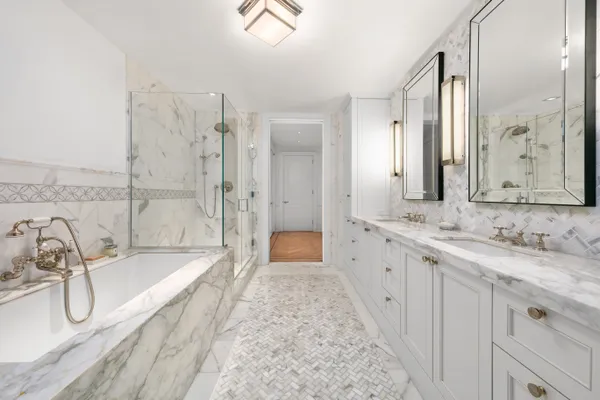 a bathroom with a granite countertop tub sink double vanity granite and a shower