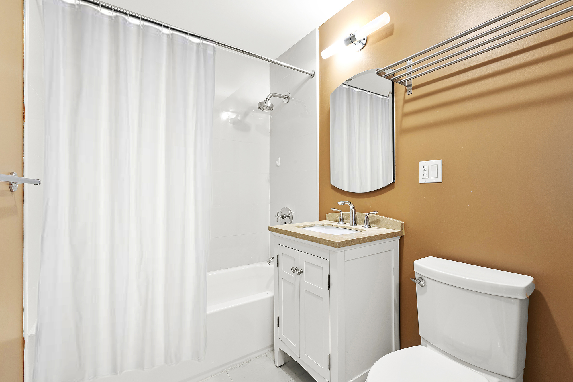 400 15th Street, Unit 2D Brooklyn, NY 11215 - Photo 6 of 8 a bathroom with a toilet a sink and a mirror