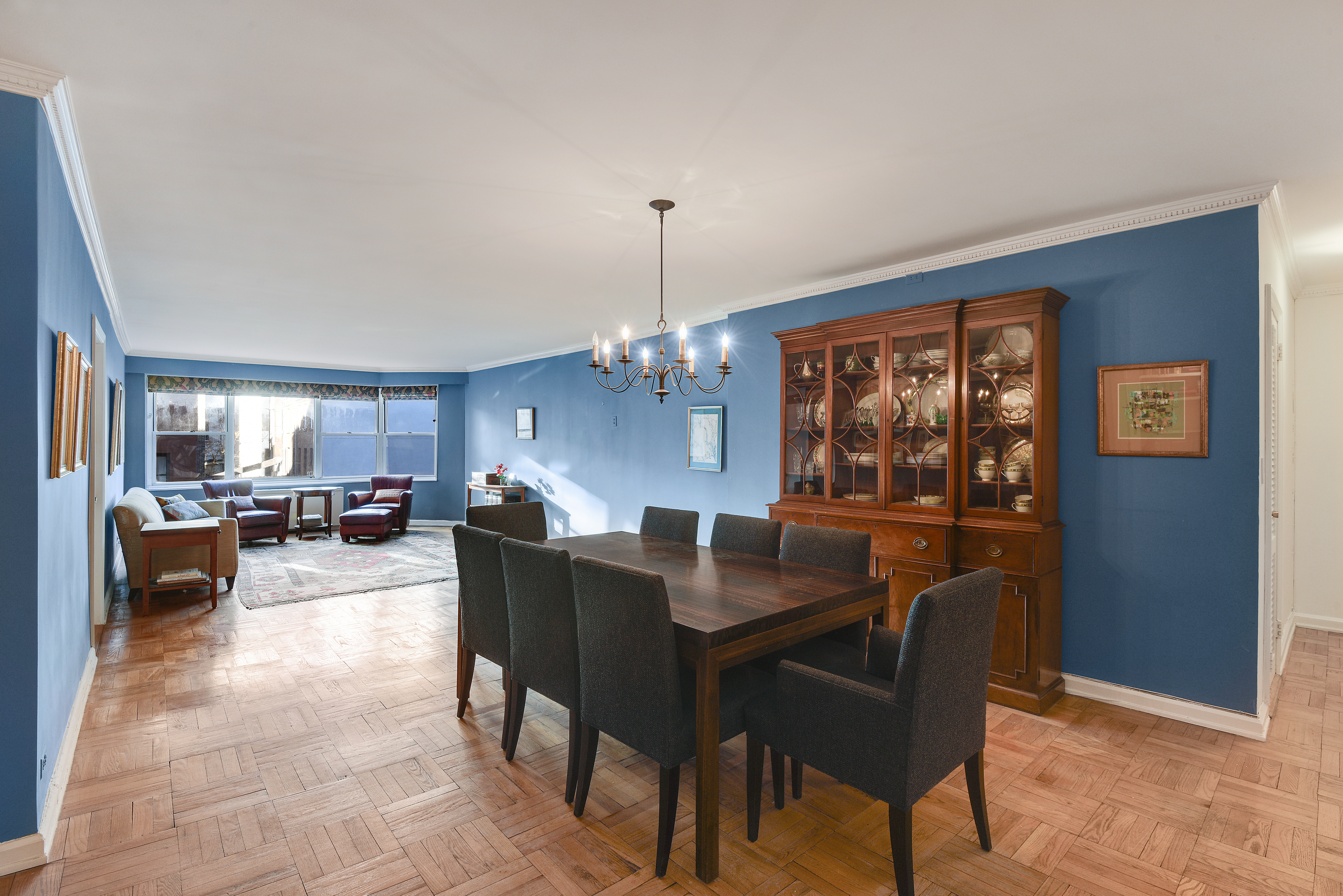 150 East 61st Street, Unit 5C Manhattan, NY 10065 - Photo 10 of 18 a view of a dining room with furniture window and wooden floor