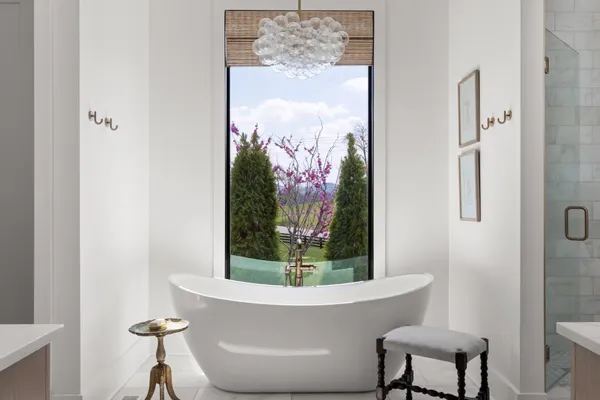 a bathroom with a sink mirror and vanity
