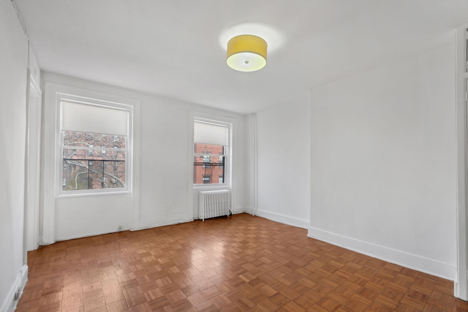 48 Livingston Street, Unit 3F Brooklyn, NY 11201 - Photo 2 of 11 an empty room with windows