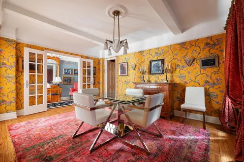 a living room with patio furniture and a window