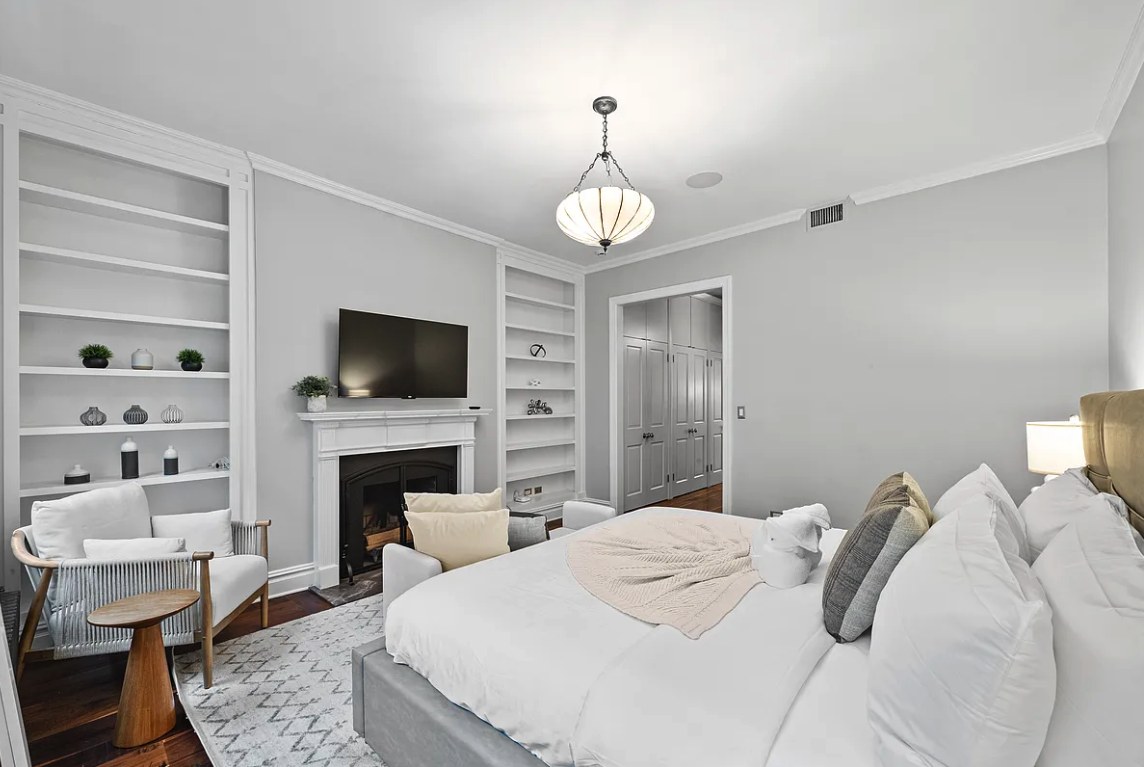 58 Downing Street Manhattan, NY 10014 - Photo 10 of 21 a bedroom with a bed and a flat screen tv