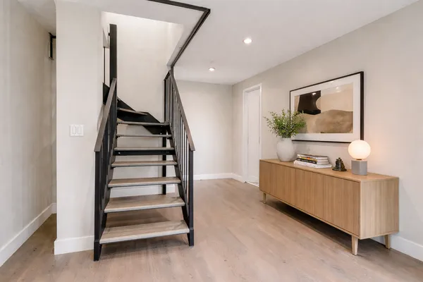 a room with stairs and furniture