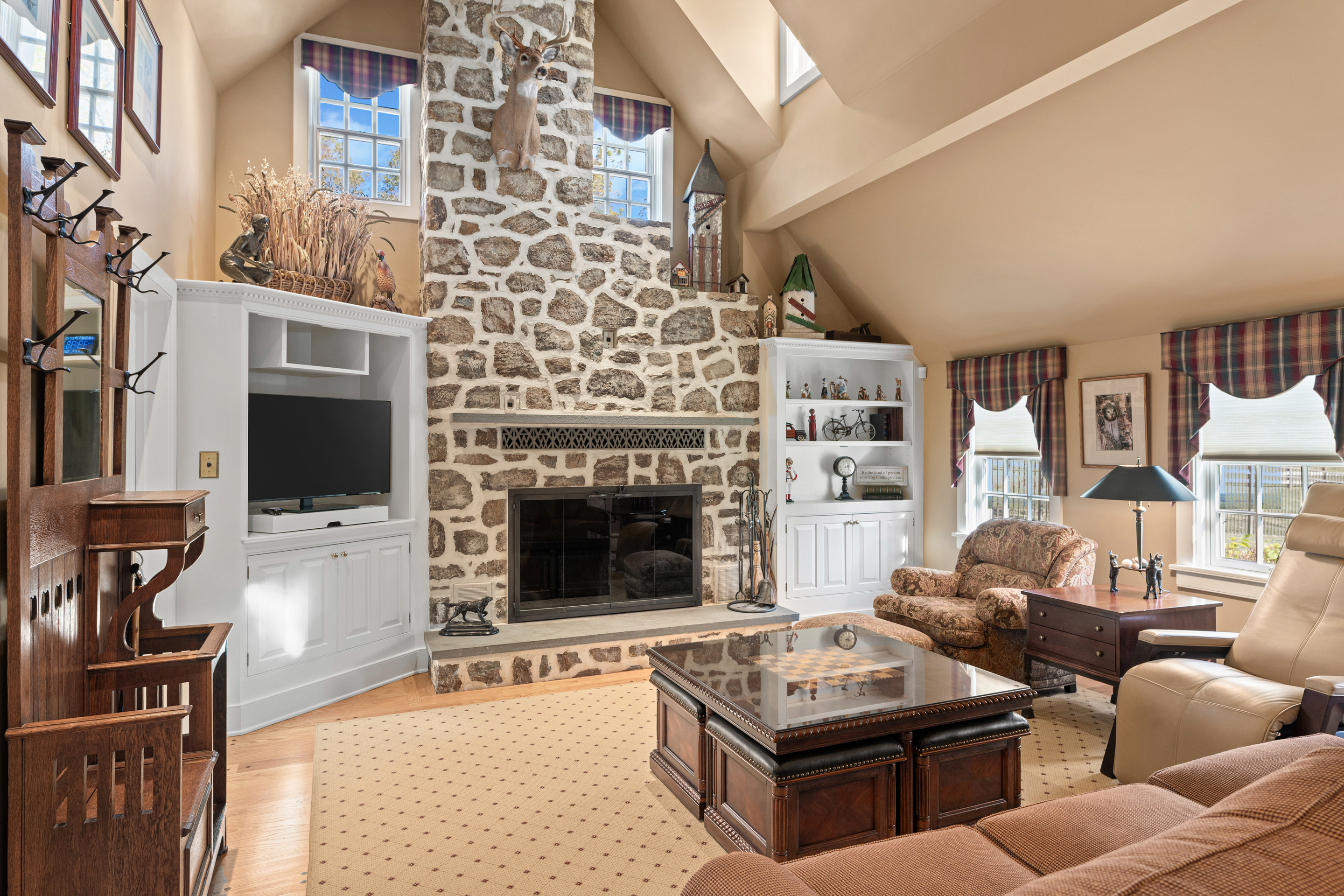 791 Grubbs Mill Road Berwyn, PA 19312 - Photo 21 of 76 a living room with furniture flat screen tv and a fireplace