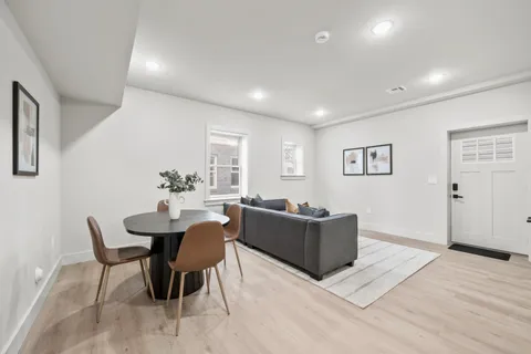 a living room with furniture flowerpot and a potted plant