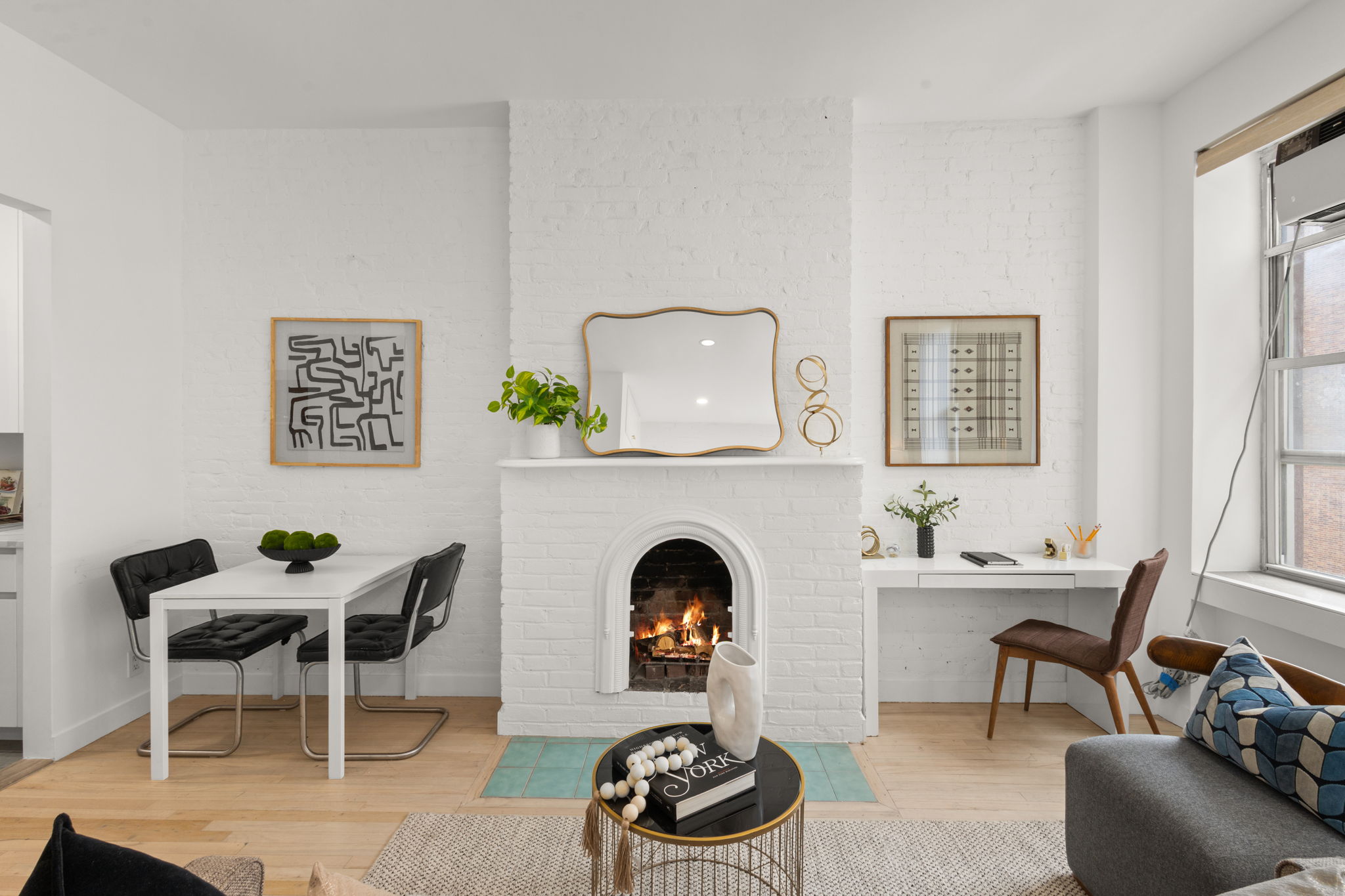 237 East 12th Street, Unit 2A Manhattan, NY 10003 - Photo 2 of 16 a living room with furniture and a fireplace