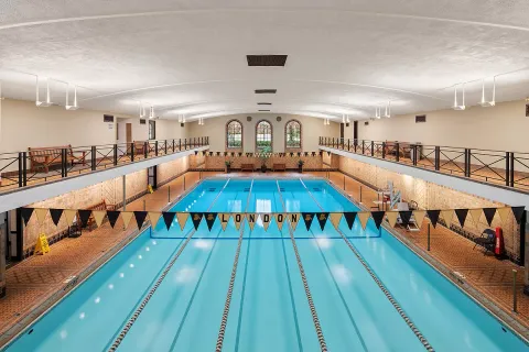 a large space with lots of wooden furniture and large windows