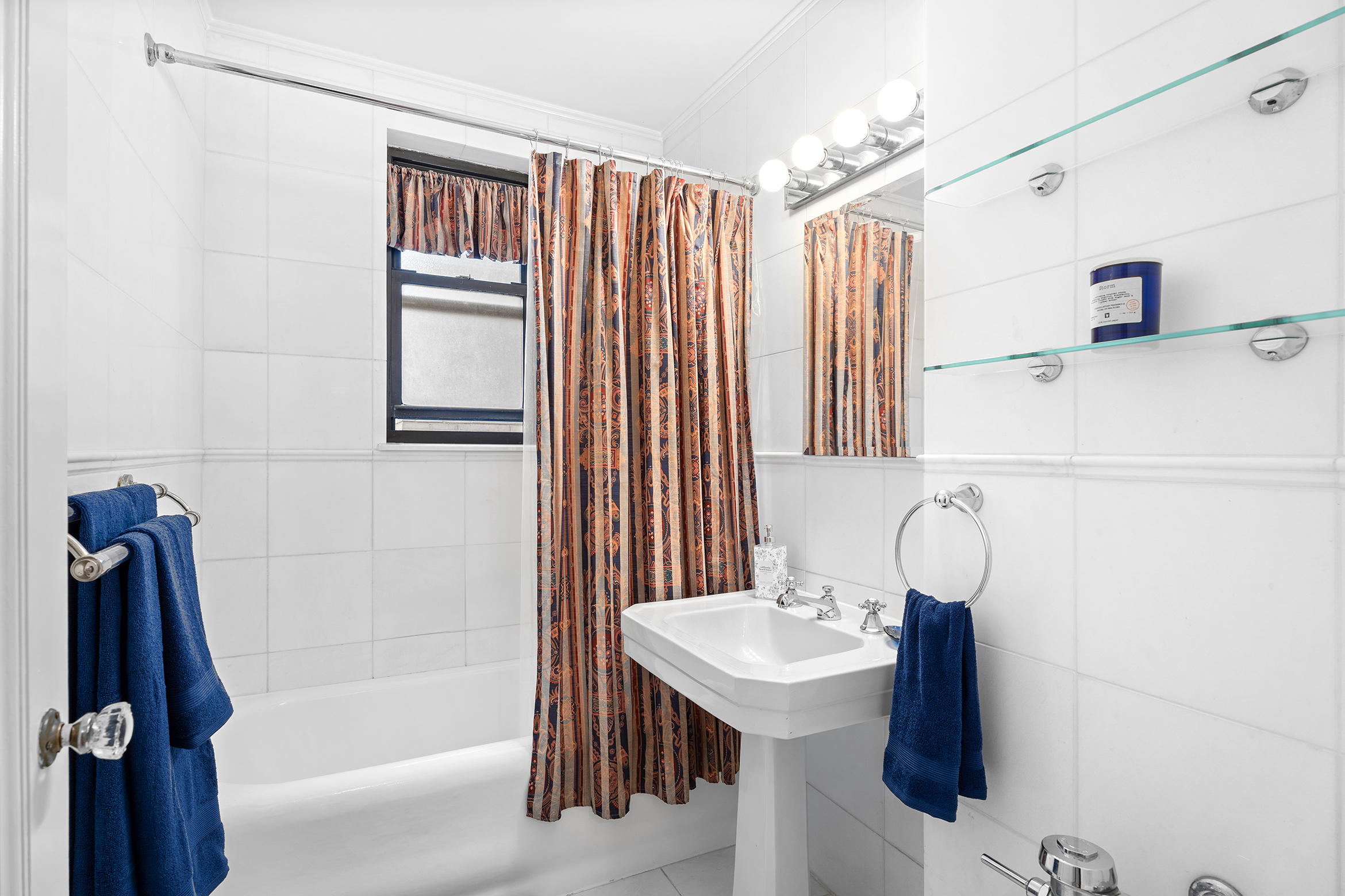 1435 Lexington Avenue, Unit 10C Manhattan, NY 10128 - Photo 6 of 12 a bathroom with a sink a bathtub and a shower
