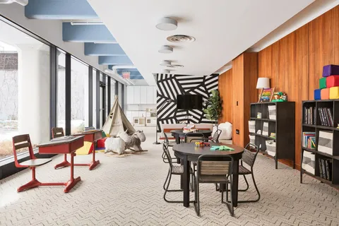 a room with lots of tables and chairs