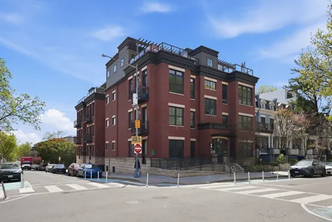 a view of a building and a street