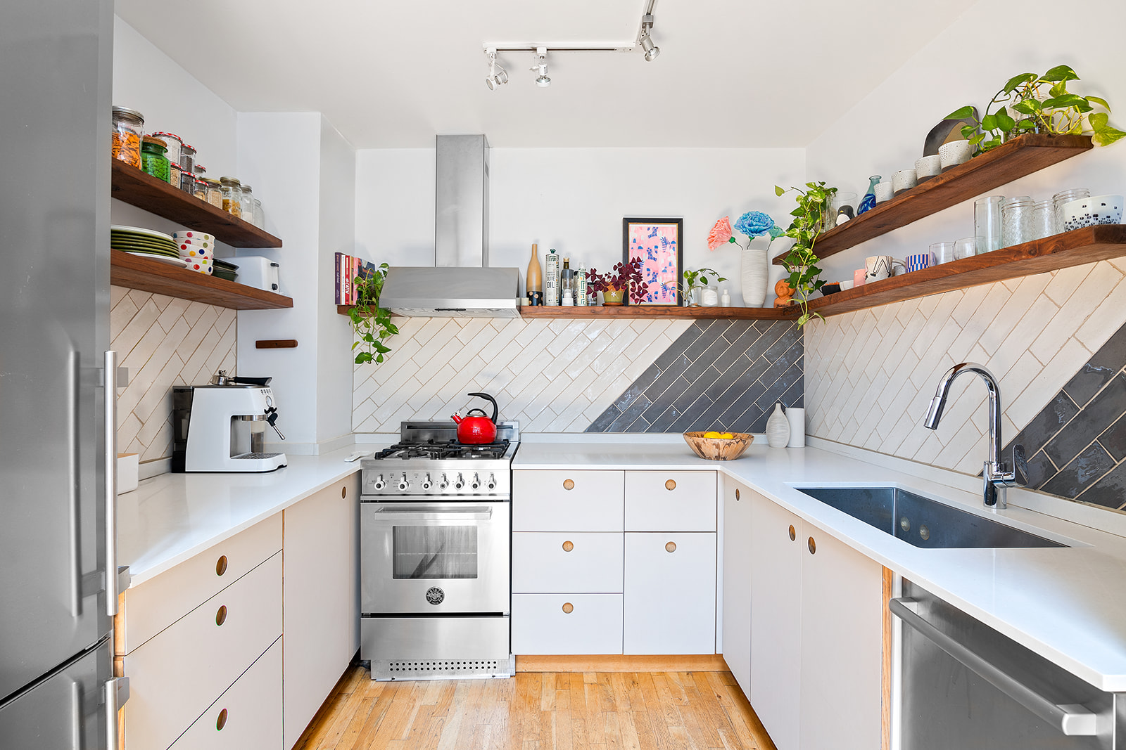 57 3rd Street, Unit 7 Brooklyn, NY 11231 - Photo 5 of 13 a kitchen with white cabinets and sink