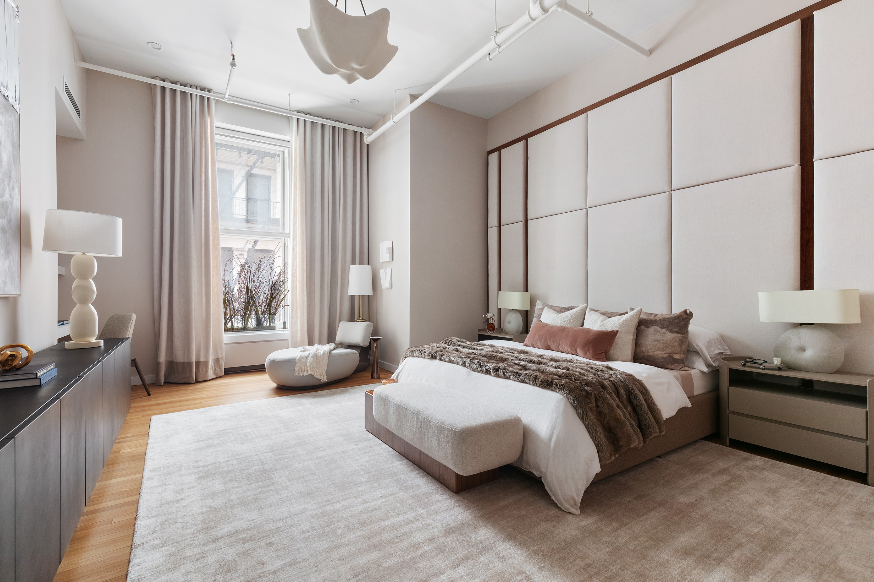 76 Crosby Street, Unit 2A Manhattan, NY 10012 - Photo 6 of 12 a spacious bedroom with a bed and a couch