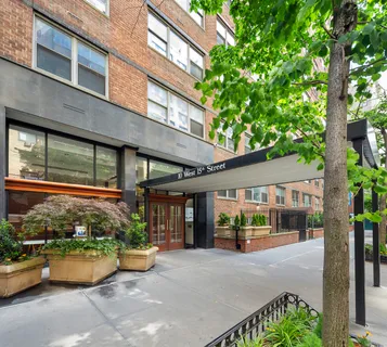 a view of a chair and table in the house front view