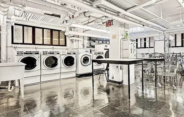 a utility room with lots of wooden cabinets