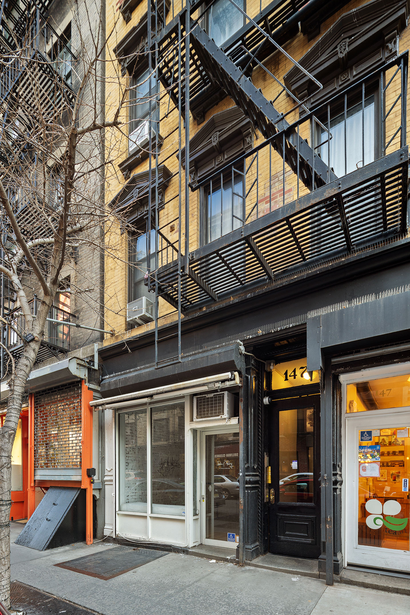 147 Sullivan Street, Unit 5C Manhattan, NY 10012 - Photo 5 of 6 a view of a building with door