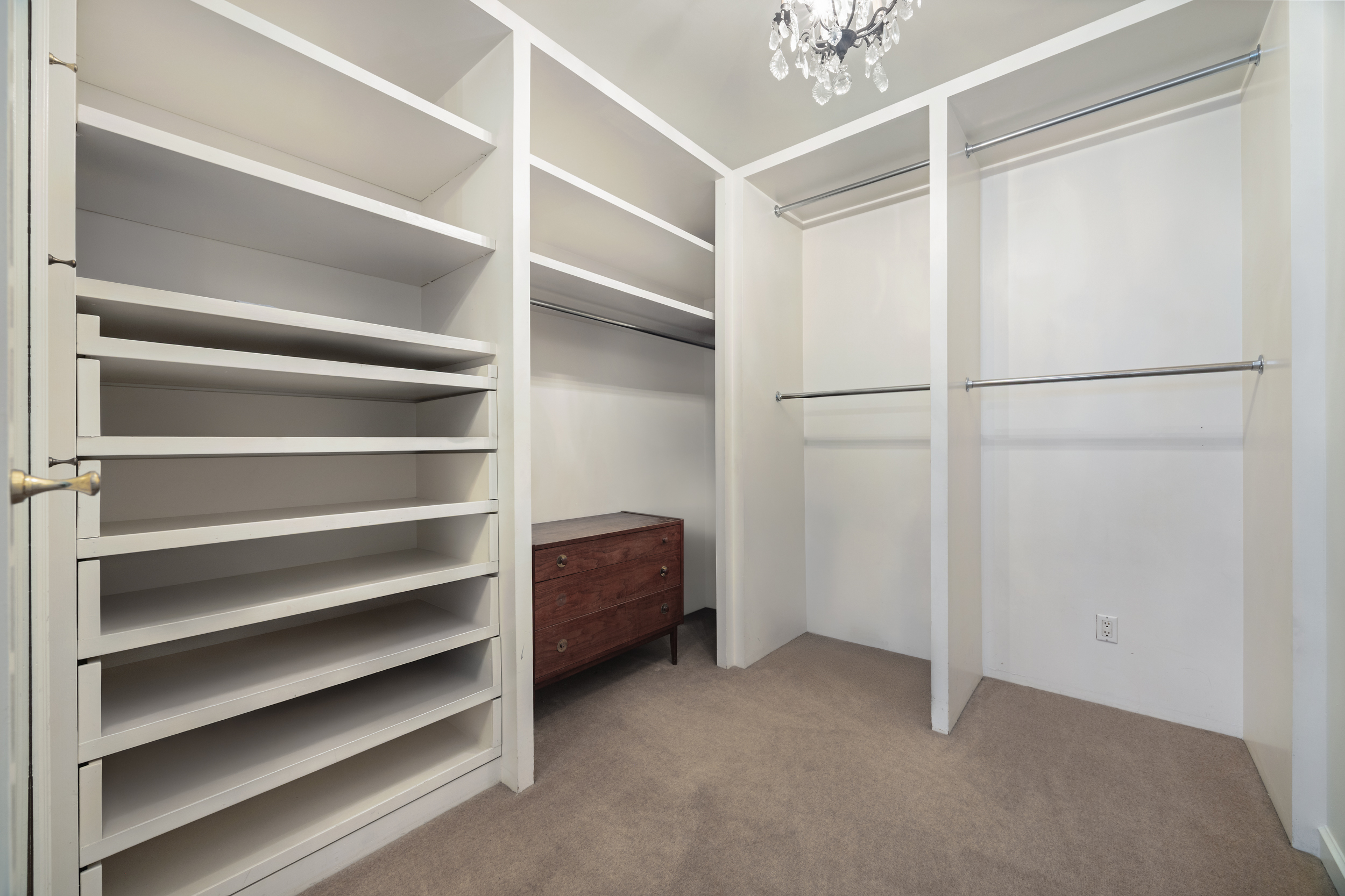 260 West Broadway, Unit 10D Manhattan, NY 10013 - Photo 13 of 20 a view of walk in closet with empty racks