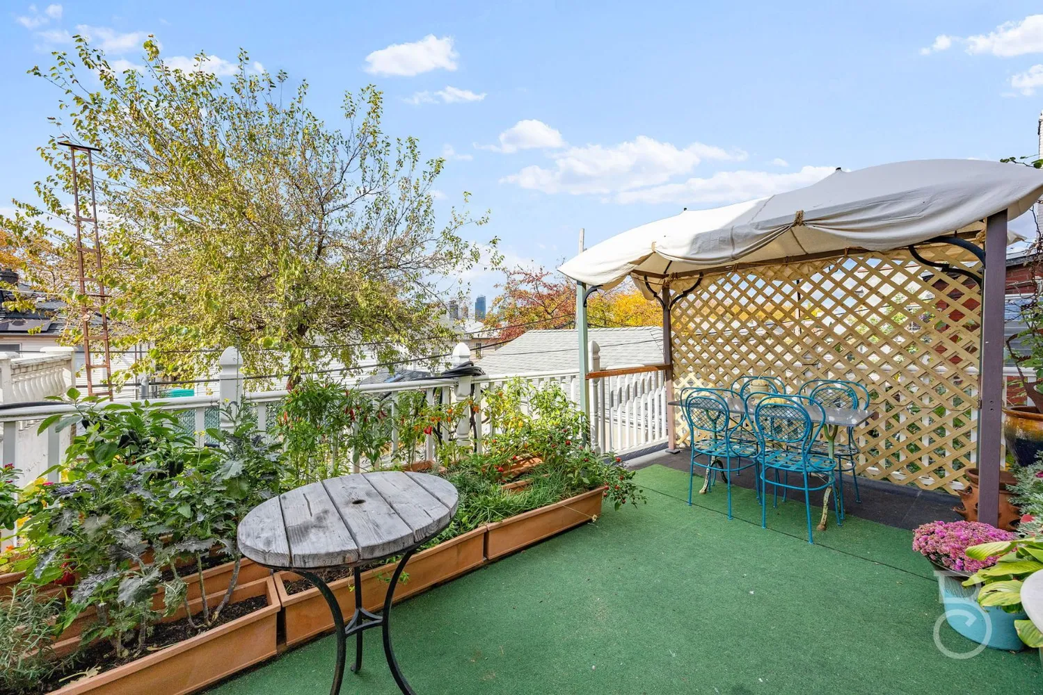 a balcony with a table and chairs
