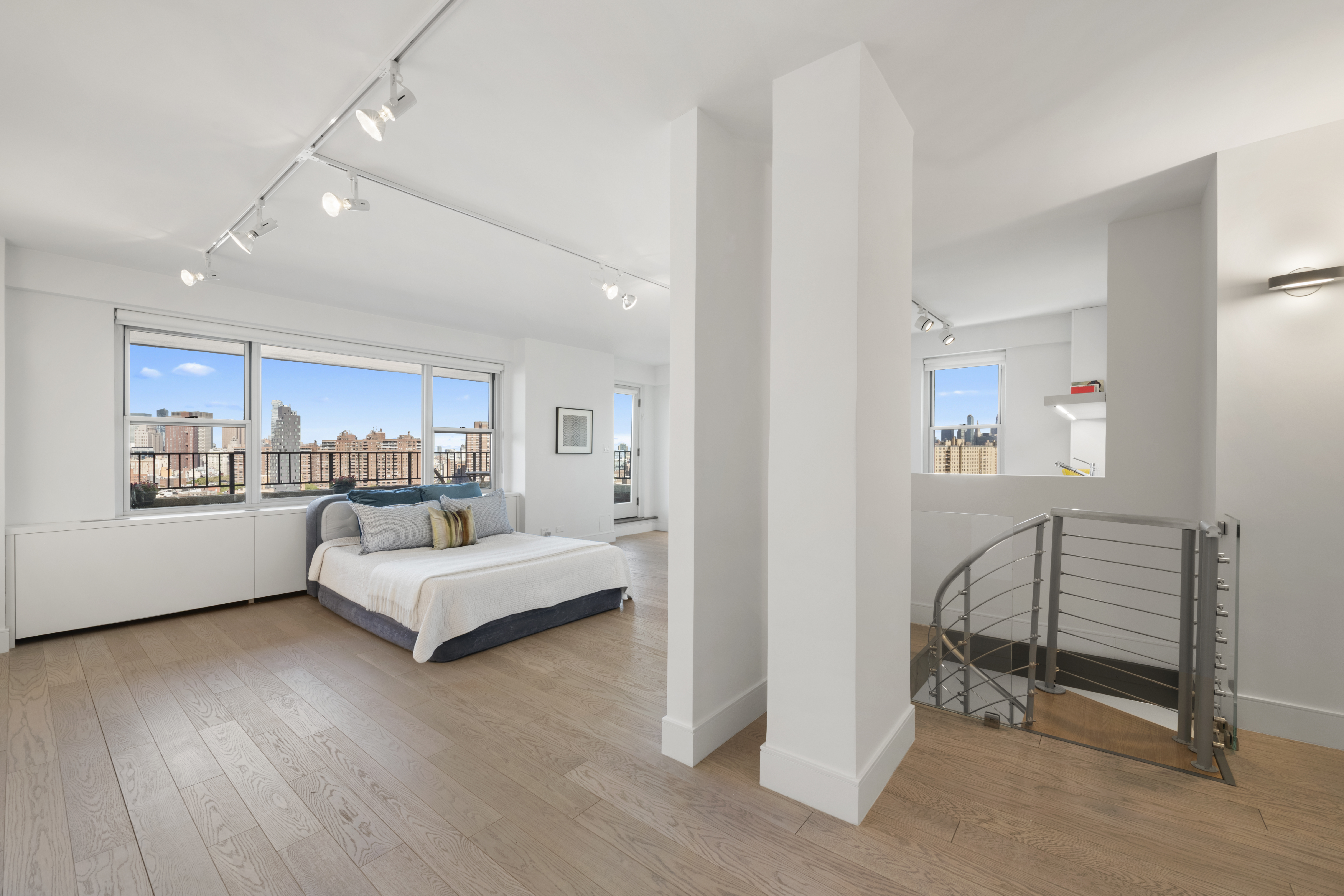 573 Grand Street, Unit D1707/1801 Manhattan, NY 10002 - Photo 15 of 24 a living room with furniture and a wooden floor