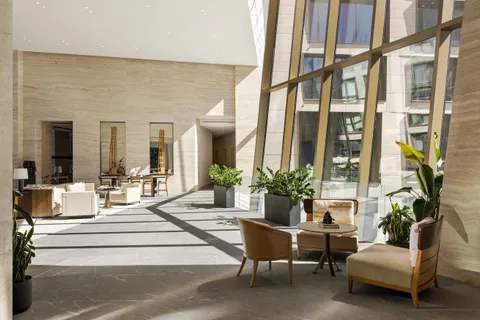 a building outdoor space with patio furniture and potted plant