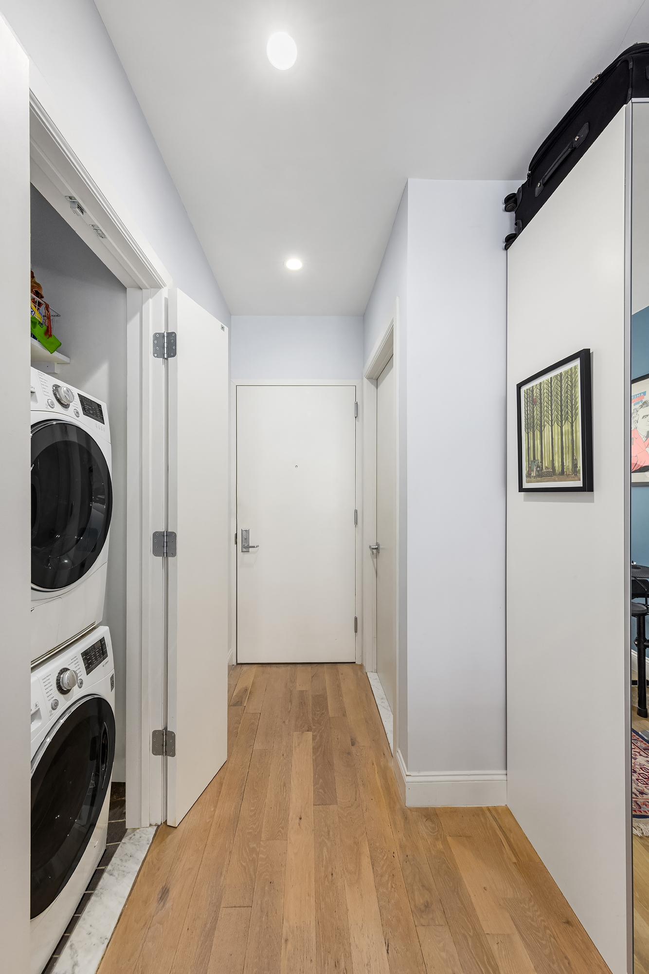 664 Jefferson Avenue, Unit 2B Brooklyn, NY 11221 - Photo 6 of 10 a view of a hallway with washer and dryer
