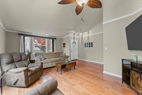 a living room with furniture and a flat screen tv