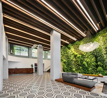 a dining room with furniture and rug