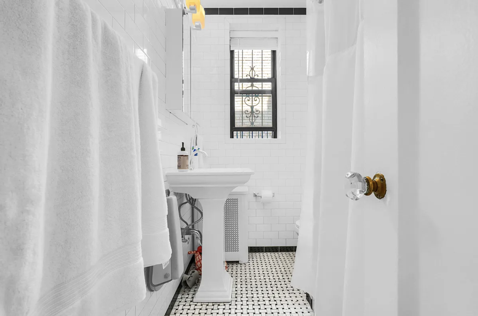 12 Clark Street, Unit 5B Brooklyn, NY 11201 - Photo 7 of 9 a bathroom with a sink a toilet and shower