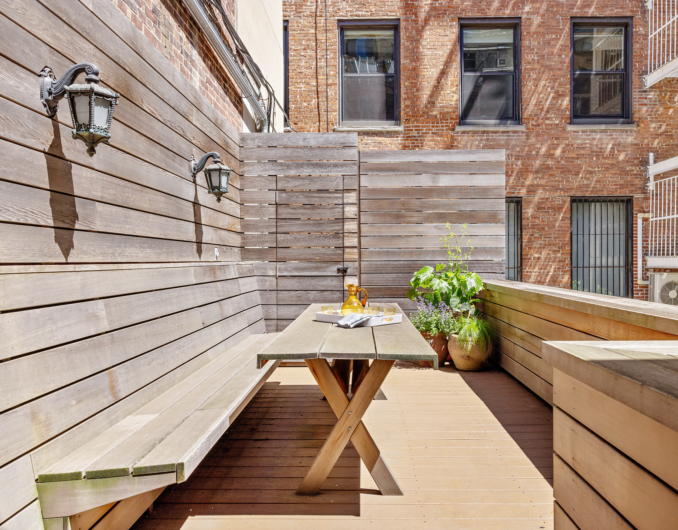 9 West 16th Street, Unit 3 Manhattan, NY 10011 - Photo 7 of 16 a view of a balcony with chairs and a potted plant