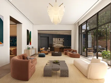 a living room with furniture fireplace and large windows