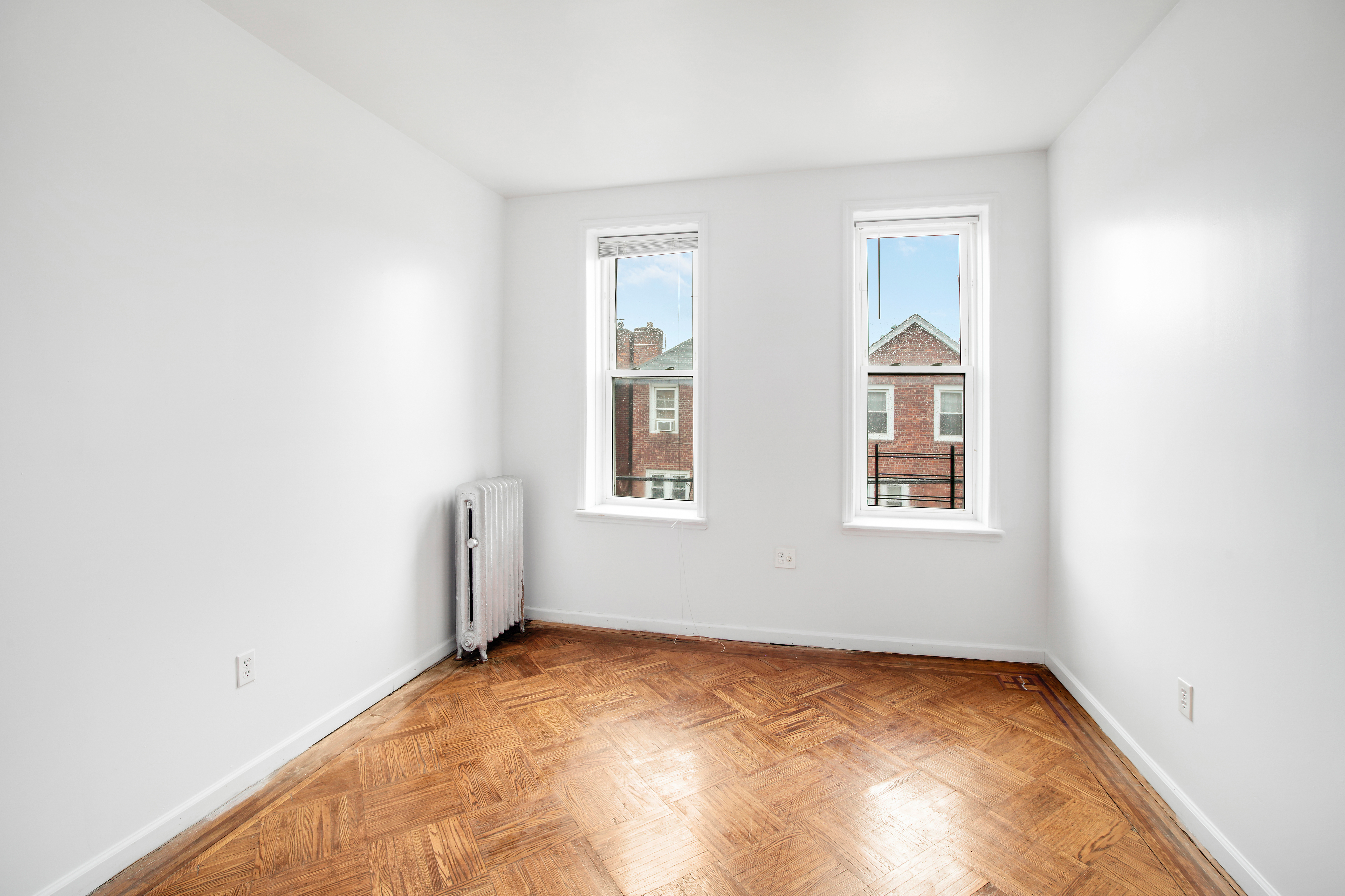 361 East 54th Street, Unit 2R Brooklyn, NY 11203 - Photo 5 of 9 an empty room with windows