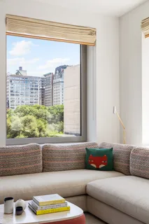 a living room with a couch and a window