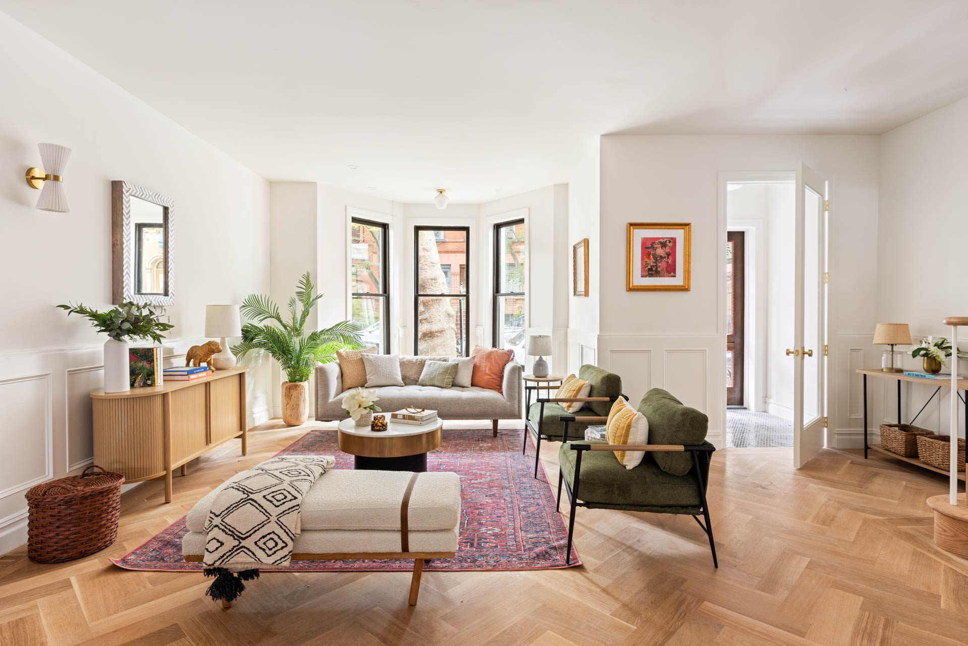 a living room with furniture or couch and a potted plant