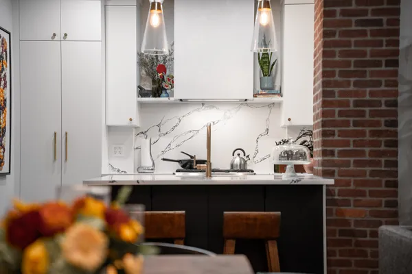 a kitchen with a sink and cabinets