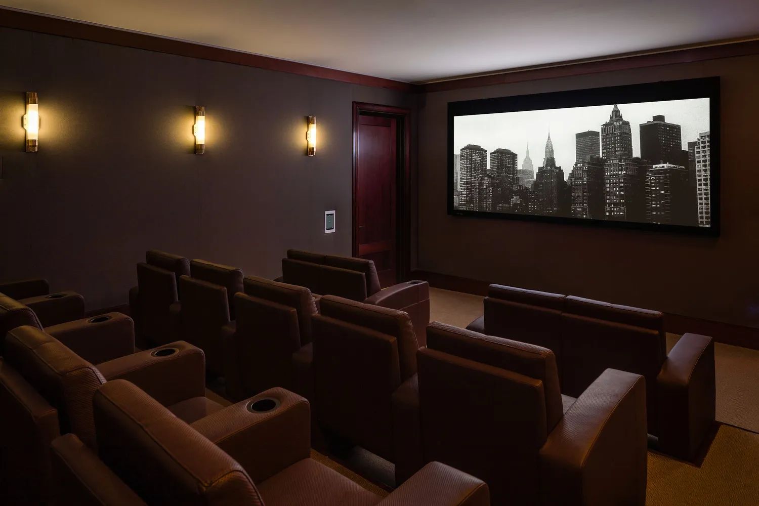 160 West 12th Street, Unit 26 Manhattan, NY 10011 - Photo 8 of 10 a media room with lots of chairs and a projector screen