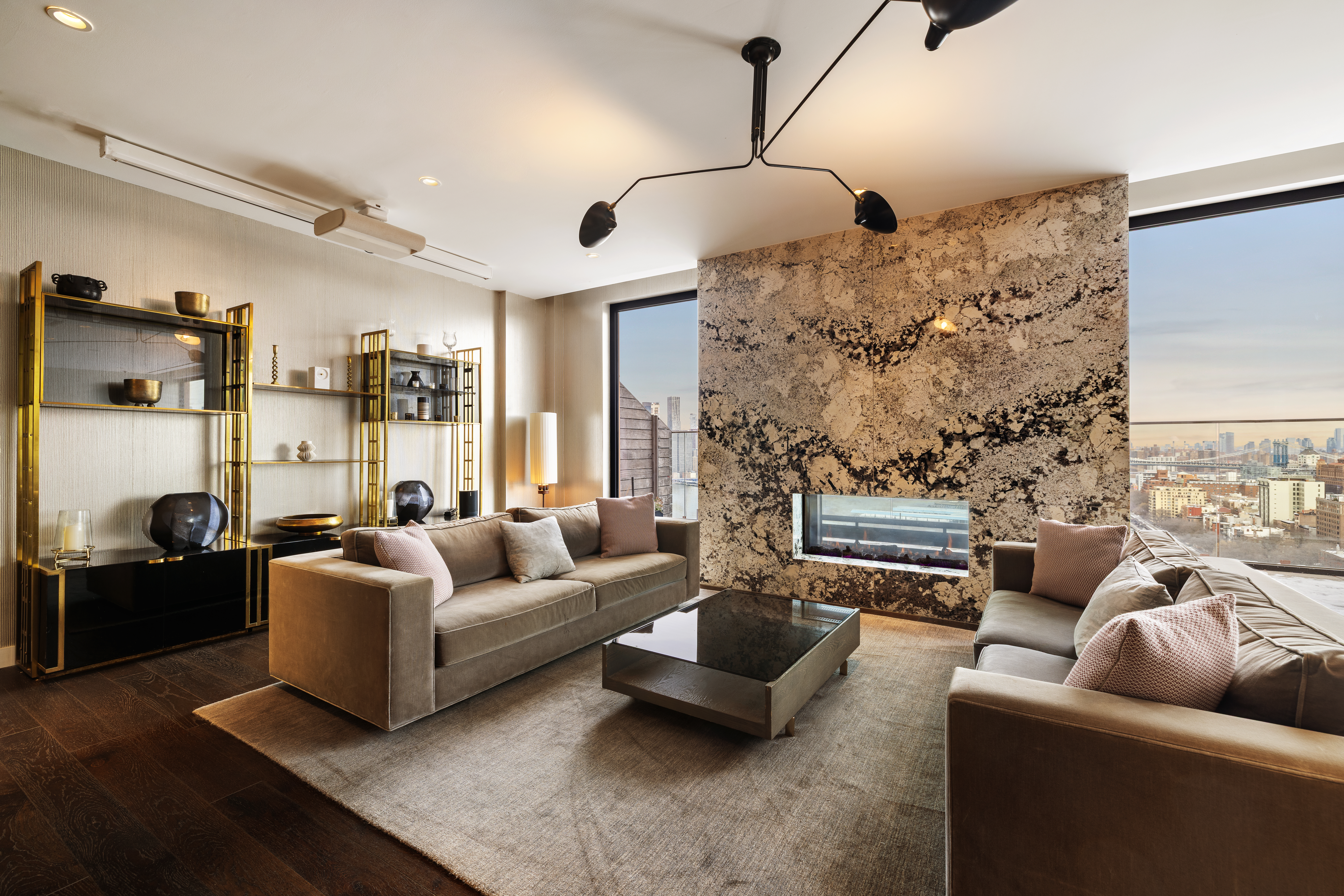 50 Bridge Park Drive, Unit 16E Brooklyn, NY 11201 - Photo 11 of 15 a living room with patio couch and a fireplace