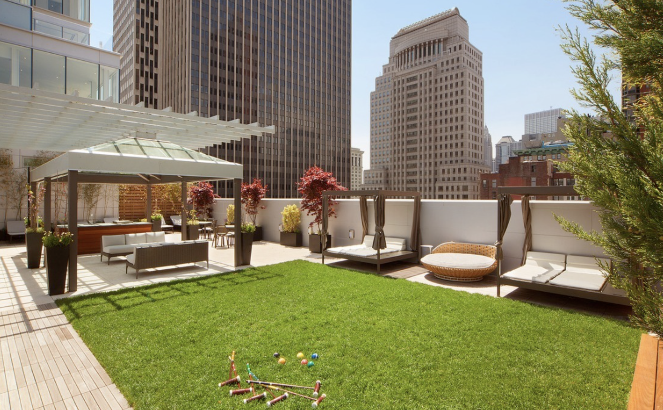 93 Worth Street, Unit 1006 Manhattan, NY 10013 - Photo 16 of 18 a view of a patio with table and chairs and potted plants