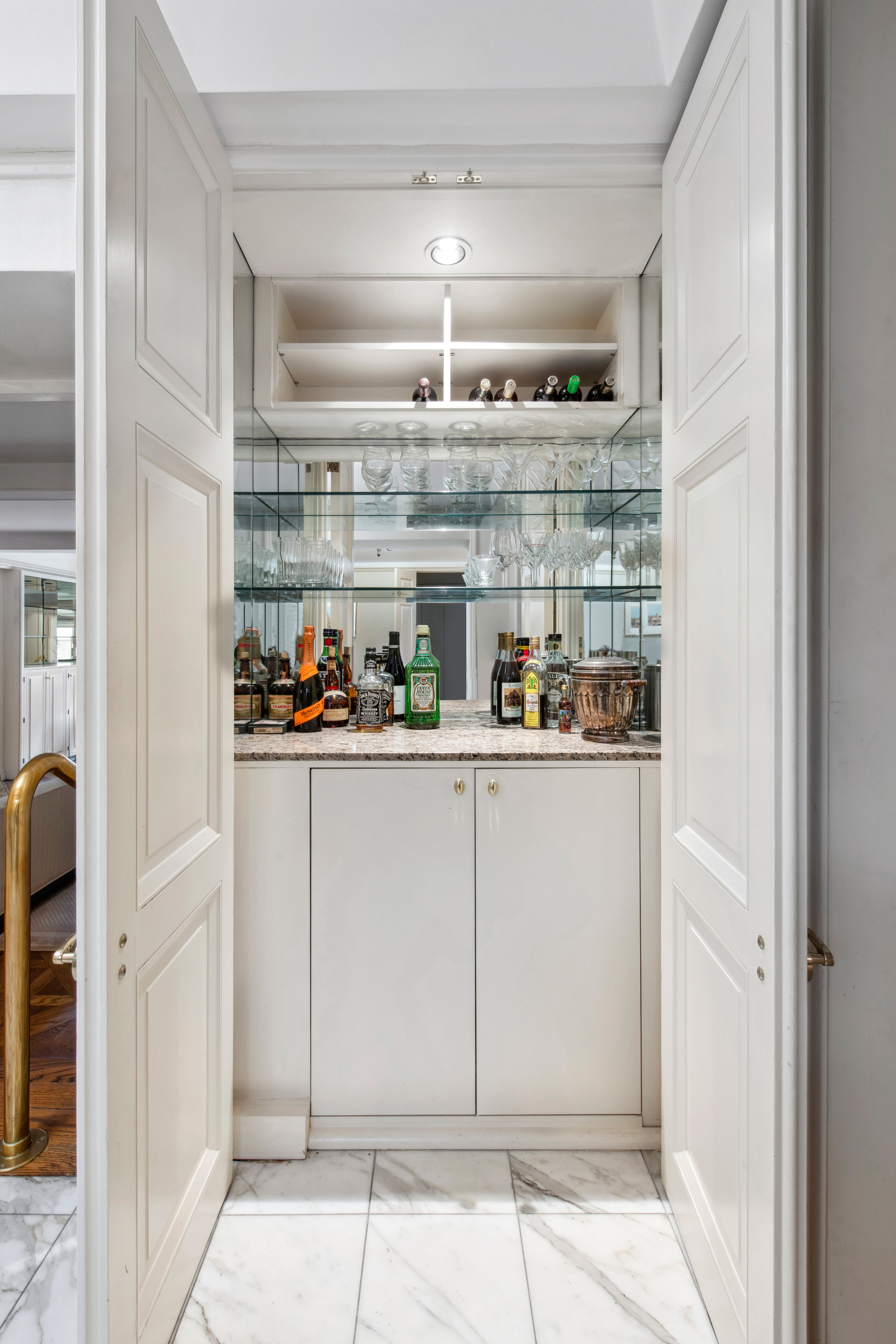 2 Sutton Place South, Unit 7F Manhattan, NY 10022 - Photo 7 of 18 a kitchen with stainless steel appliances granite countertop a refrigerator and cabinets