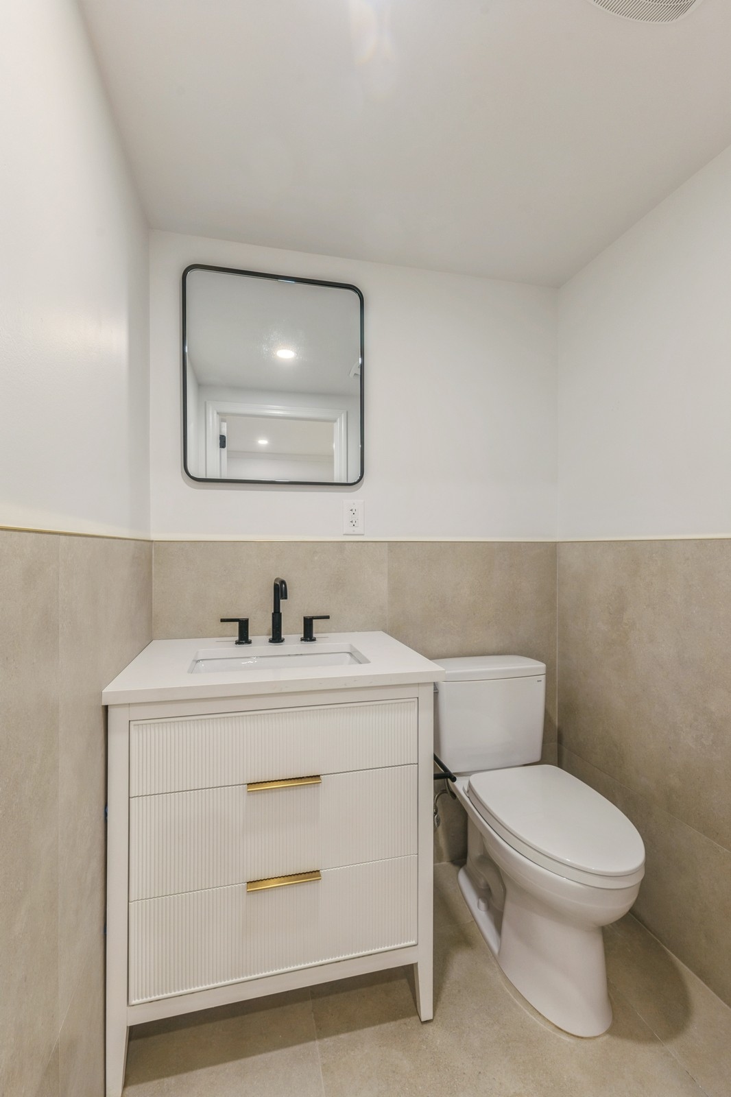 11 Park Place, Unit 1 Brooklyn, NY 11217 - Photo 11 of 16 a bathroom with a toilet a sink and mirror