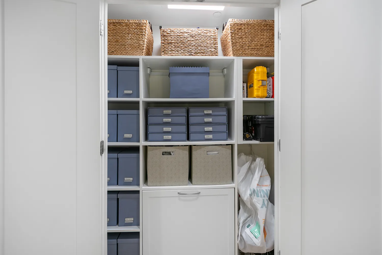a view of a hallway with wooden floor and a living room