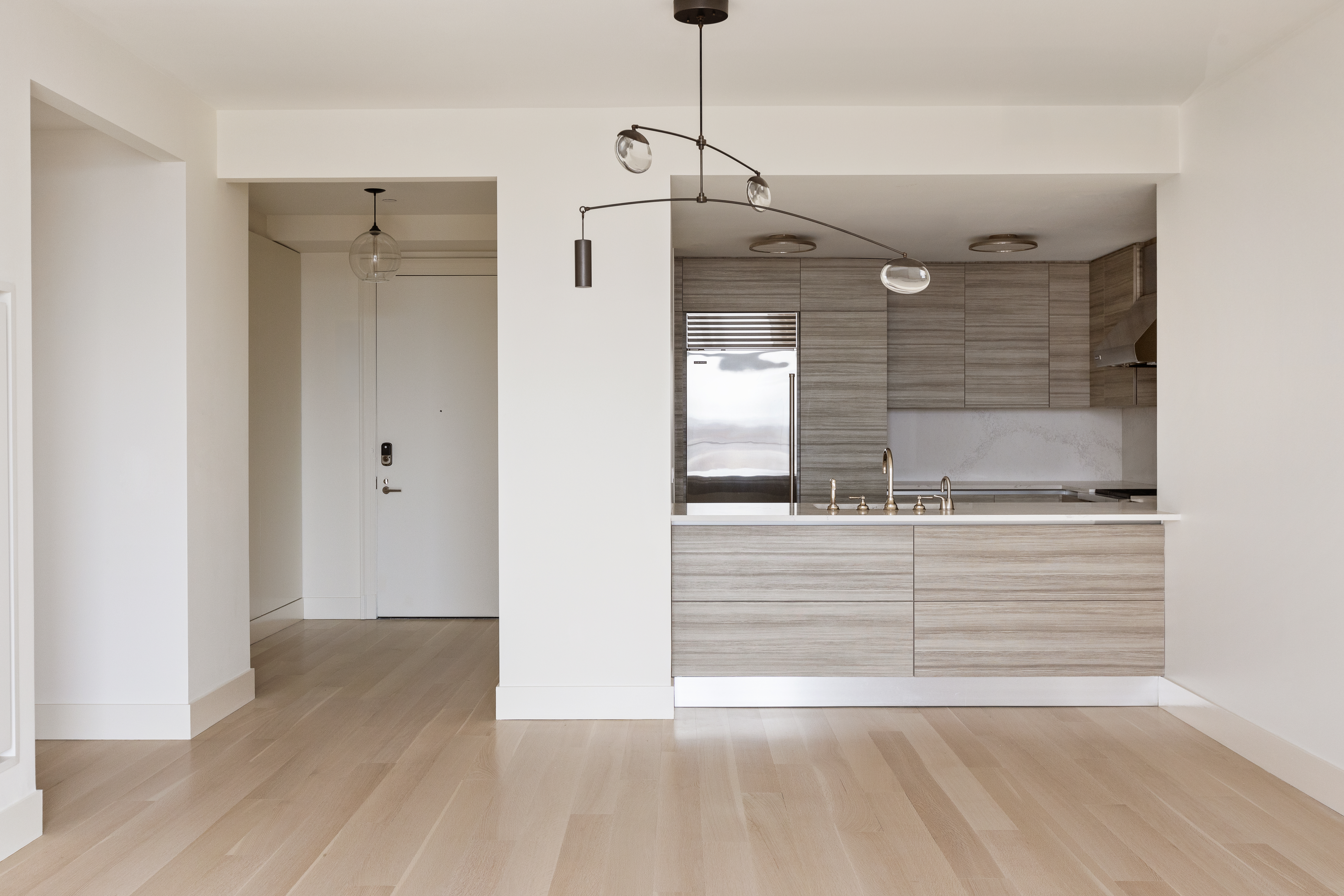 155 West 11th Street, Unit 14D Manhattan, NY 10011 - Photo 3 of 12 a view of an empty room with wooden floor and a window