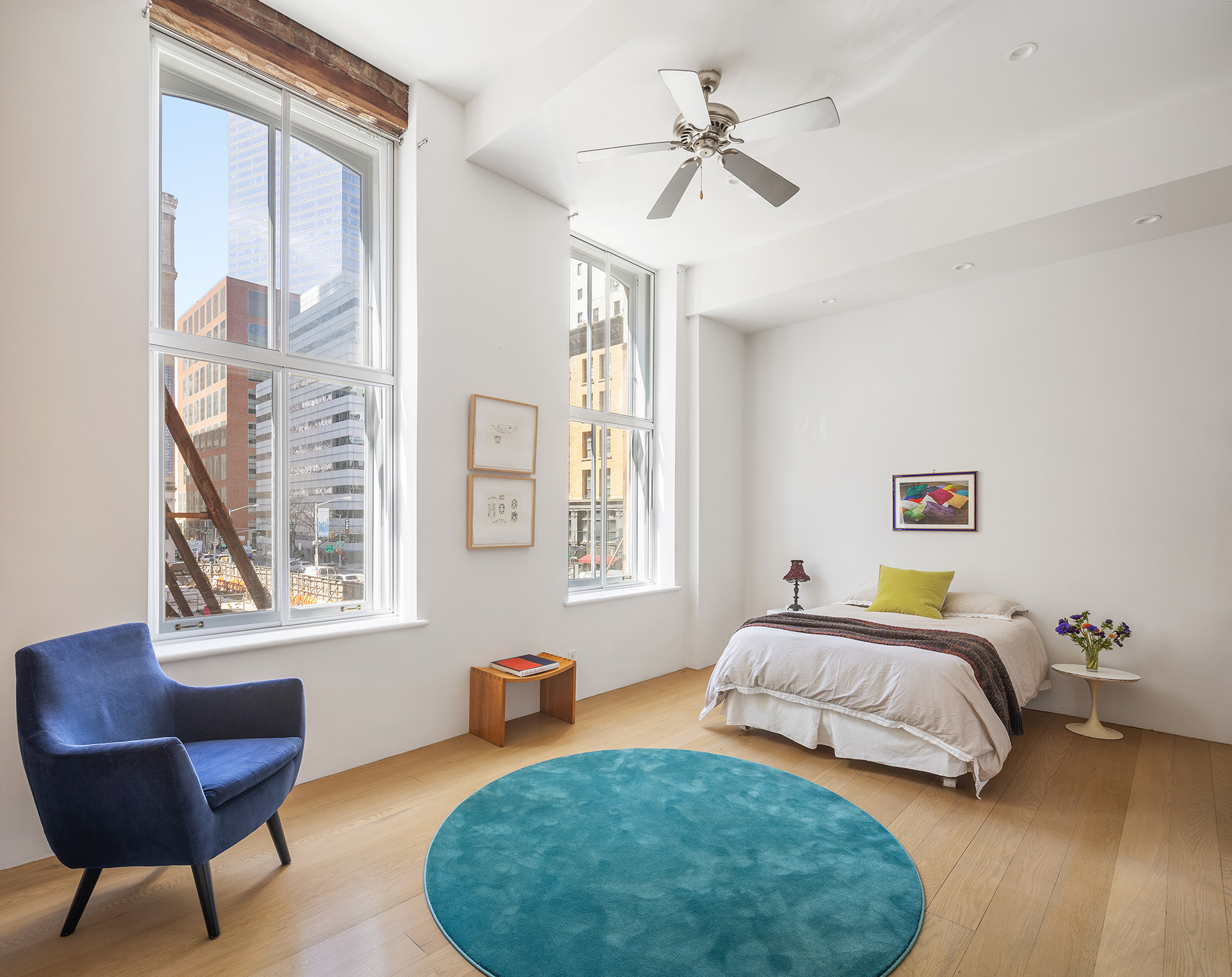 60 Warren Street, Unit 2 Manhattan, NY 10007 - Photo 11 of 16 a bedroom with a bed chair and a window