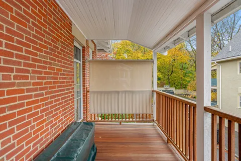 a view of a porch with wooden floor and outdoor space