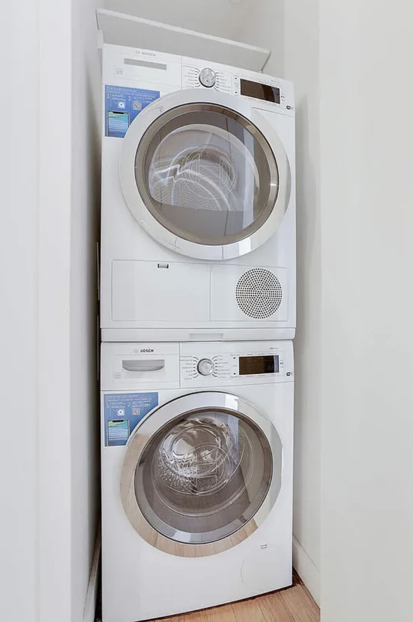 133 West 22nd Street, Unit 7H Manhattan, NY 10011 - Photo 14 of 22 a utility room with dryer and washer