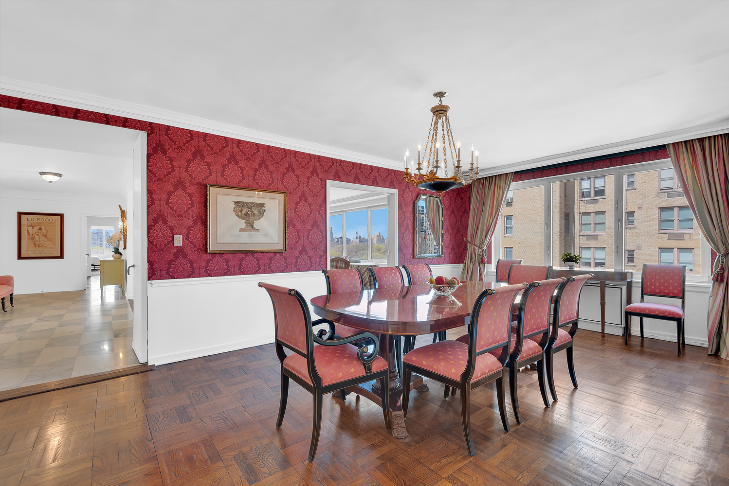 936 5th Avenue, Unit 14B Manhattan, NY 10021 - Photo 2 of 15 a view of a dining room with furniture window and wooden floor