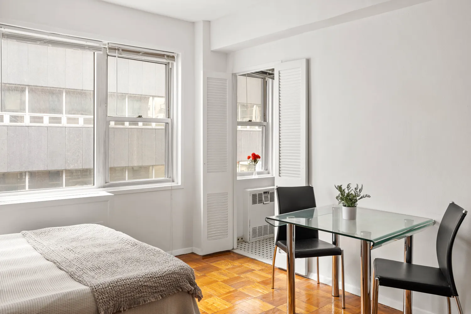 a workspace with furniture and window