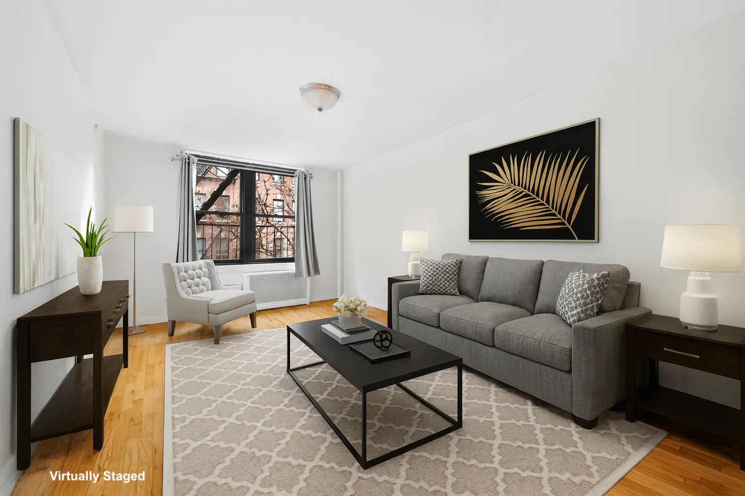 a living room with furniture and a potted plant