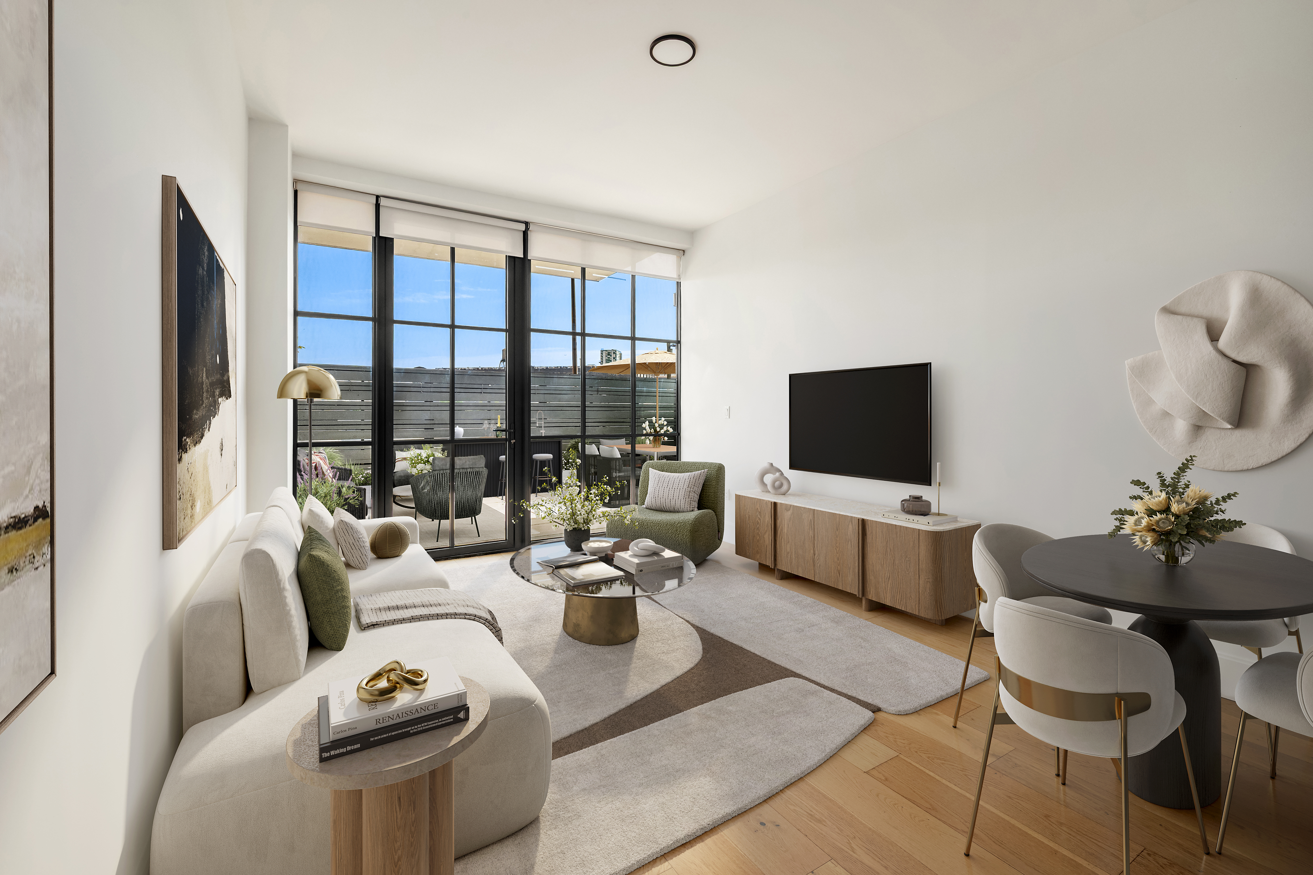 24-22 Jackson Avenue, Unit 311 Queens, NY 11101 - Photo 2 of 16 a living room with furniture a flat screen tv and a large window